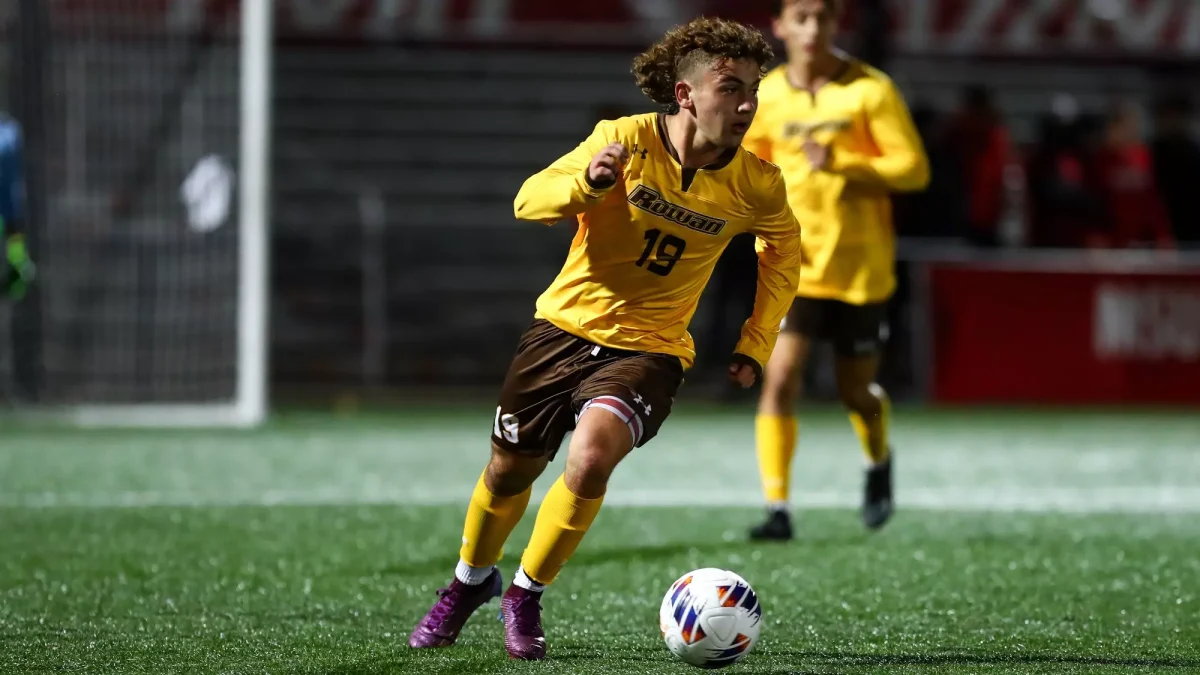 Johnny Troiano runs with the ball. Troiano scored three goals in the win. - Photo via Rowan Athletics