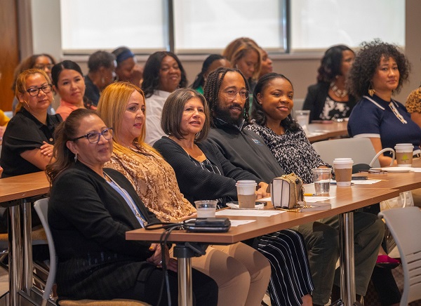 The 19 paraprofessionals that make up the Teach Camden fellows attend the announcement of the program at Rowan's Camden campus.- Photo via Rowan University