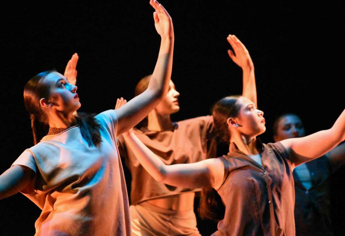 Dancers spread their arms at the Rowan Dance Festival at Pfleeger Concert Hall, Glassboro, NJ. Saturday Oct. 5, 2024. - Staff Photographer / Owen Miller