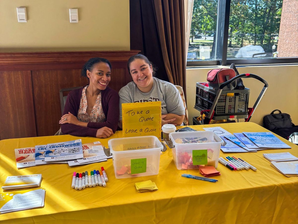 Rowan Academic Advising and Career Services staff pose for a photo at their table in Eynon Ballroom. - Contributor / Jamie Georges