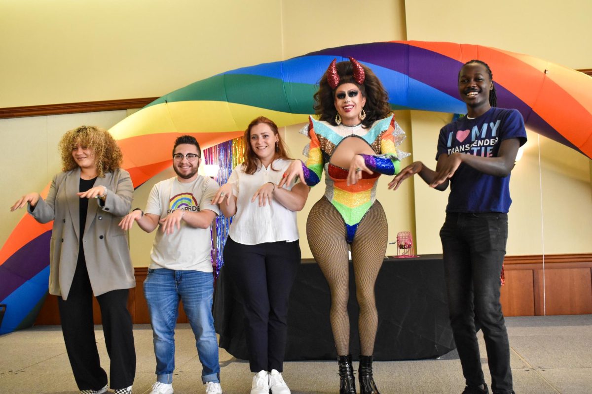 Event staff and drag queen Ophelia Bawdy pose for a group picture after the Big Gay Drag Bingo Brunch at the Rowan University Student Center Ballroom, Glassboro, NJ. Saturday, October 12th, 2024. - Staff Photographer / Owen Miller