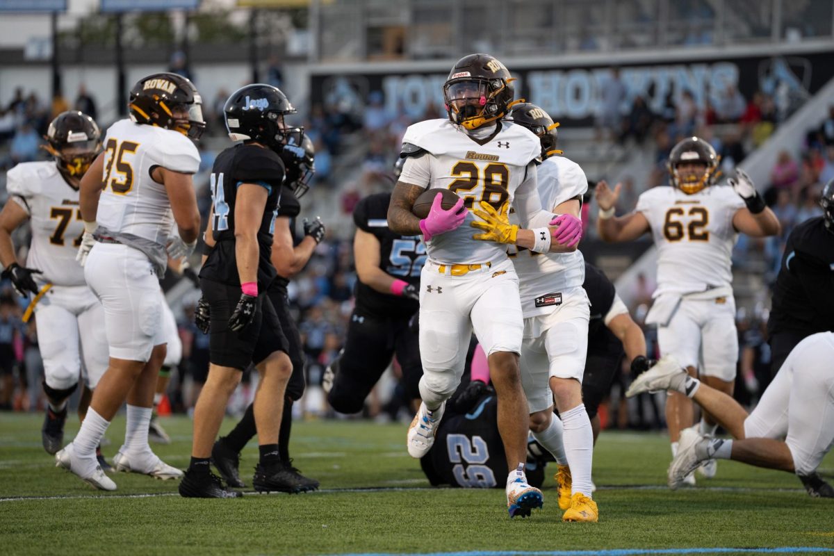 Nunes Bukula IV hits paydirt. The sophomore returned from injury and led Rowan's running backs in touches against Johns Hopkins. - Photo / Kevin Alexander 