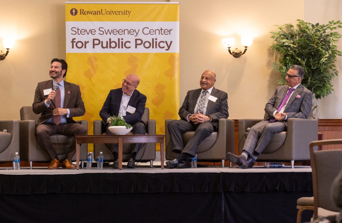 Panelists including President Houshmand speaking at the higher education conference - Photo via William Mendez