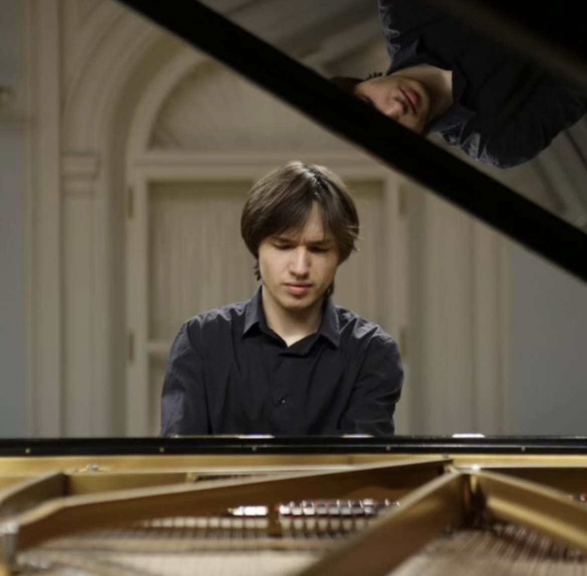 Khairutdinov playing the Piano. - Photo via Виталий Хайрутдинов (Vitalii Khairutdinov) on Facebook