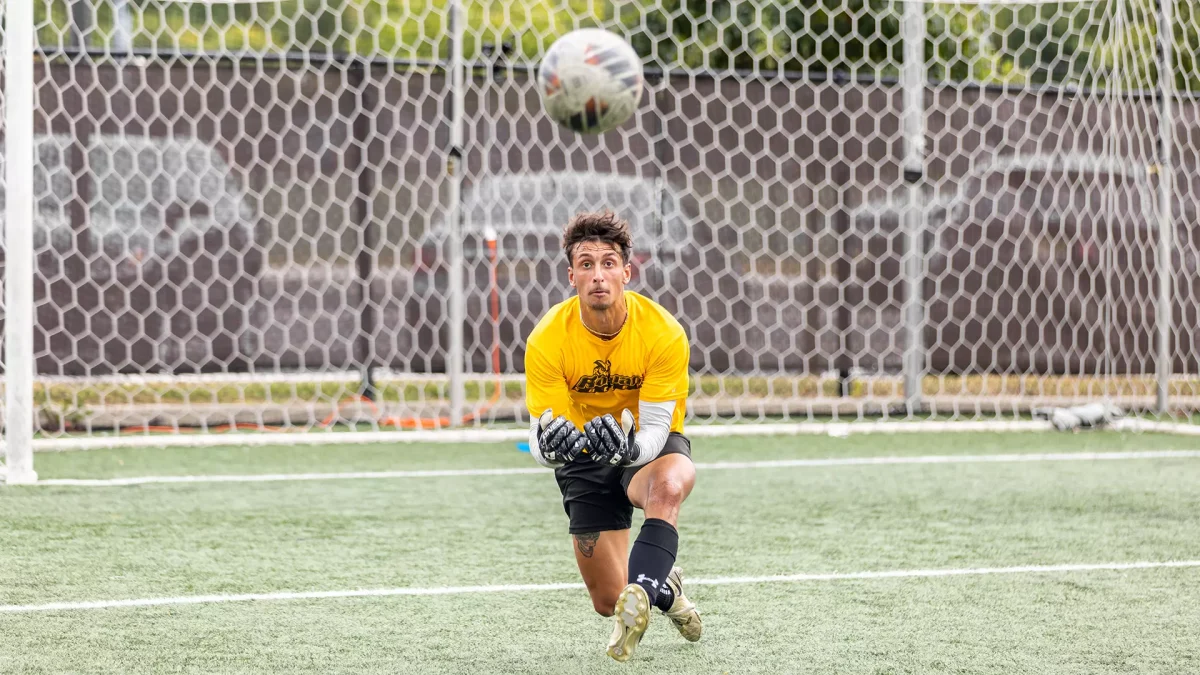 Dylan Aportela lays out for a save. Aportela recorded his fourth straight shut out in the win over Kean. - Photo via Rowan Athletics