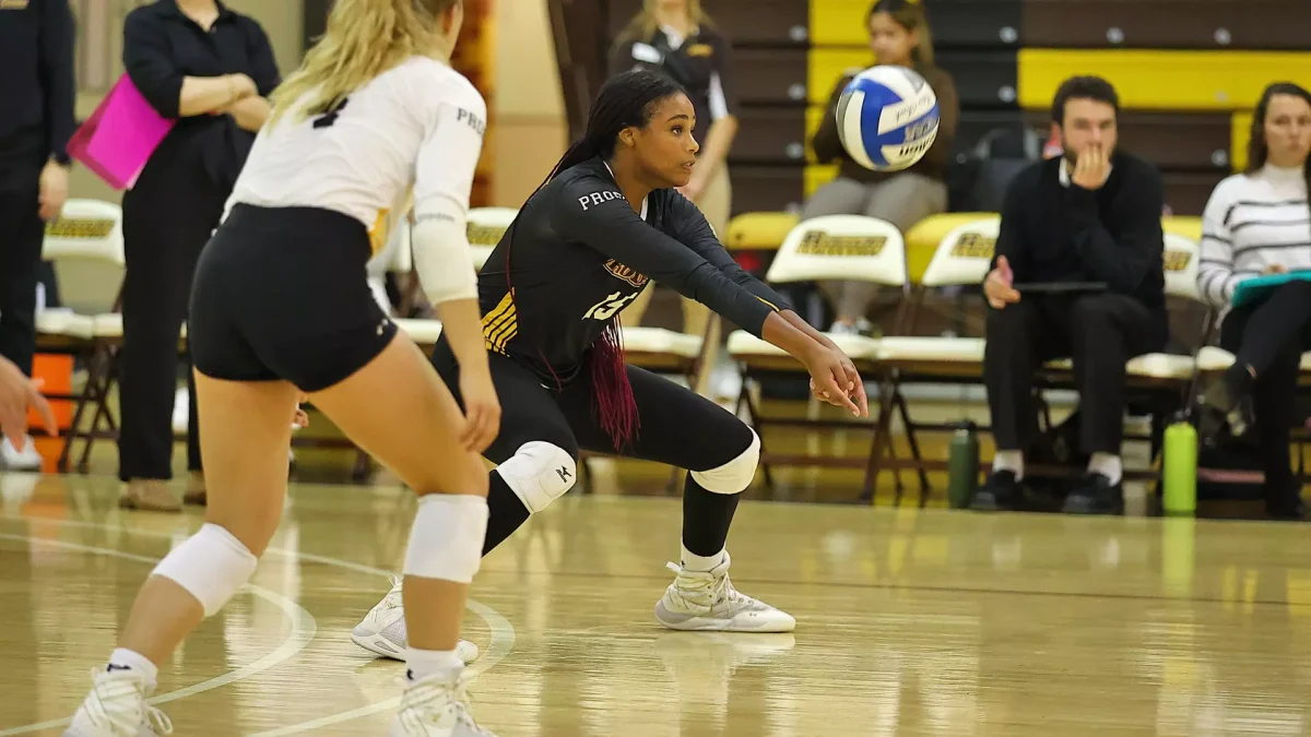 Jena Kaul sets up a teammate. Kaul had 11 kills in the win. - Photo via Rowan Athletics