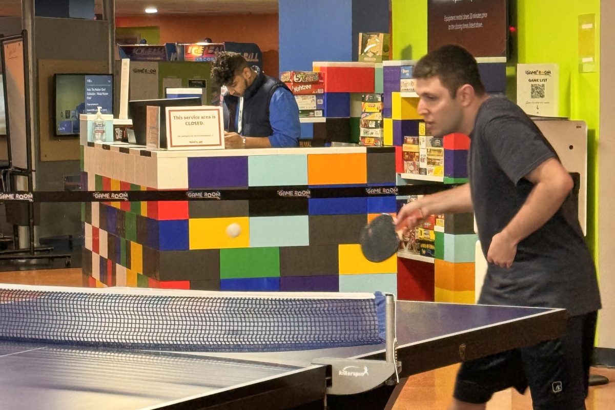 A student plays ping-pong in the reopened Game Room. - Contributor / Shayne Crowley