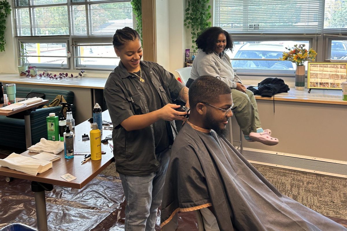 Lee Castro cuts Rowan University student's hair at True to You Haircuts event at Hawthorne Hall. - Web Editor / Maryela Gallardo