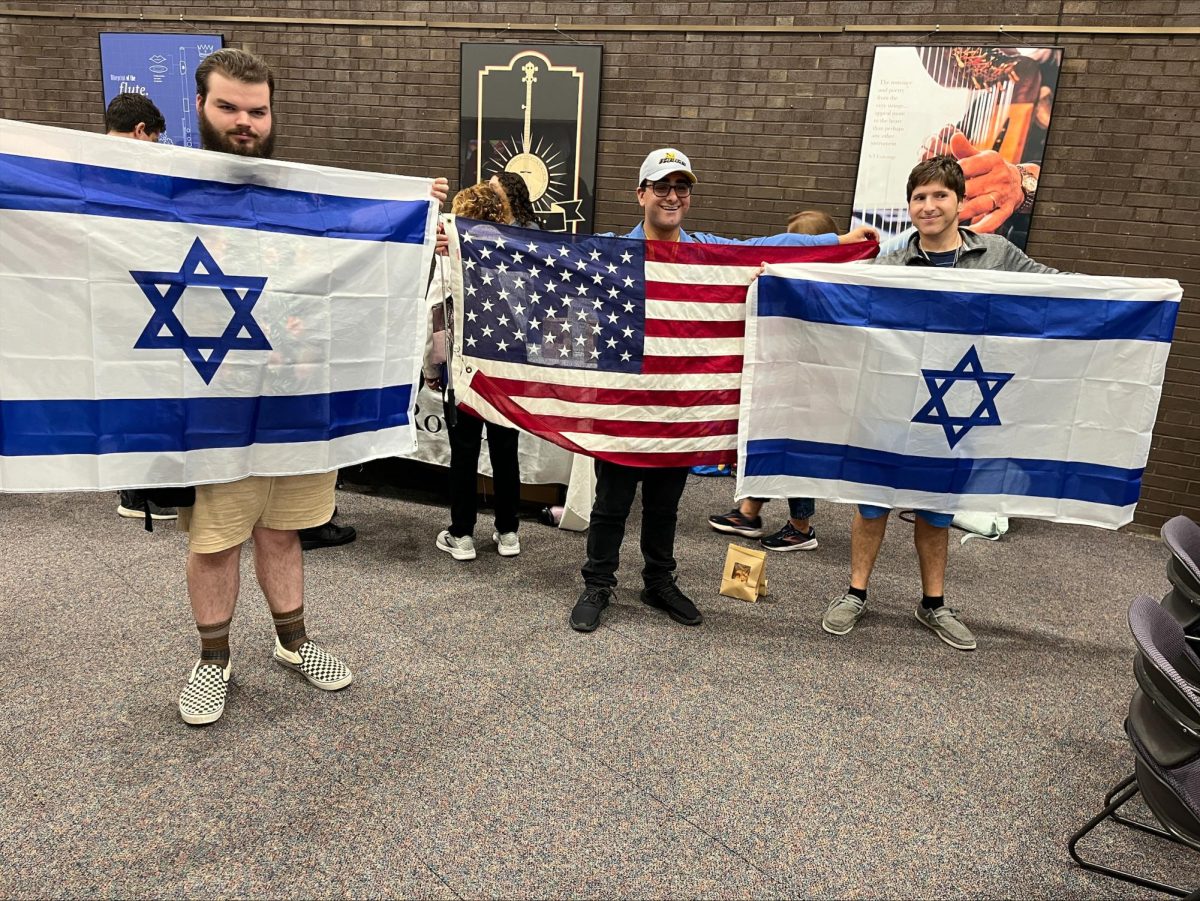 Students pose with the American and Israeli flags. - Staff Writer / Anthony Coccaro