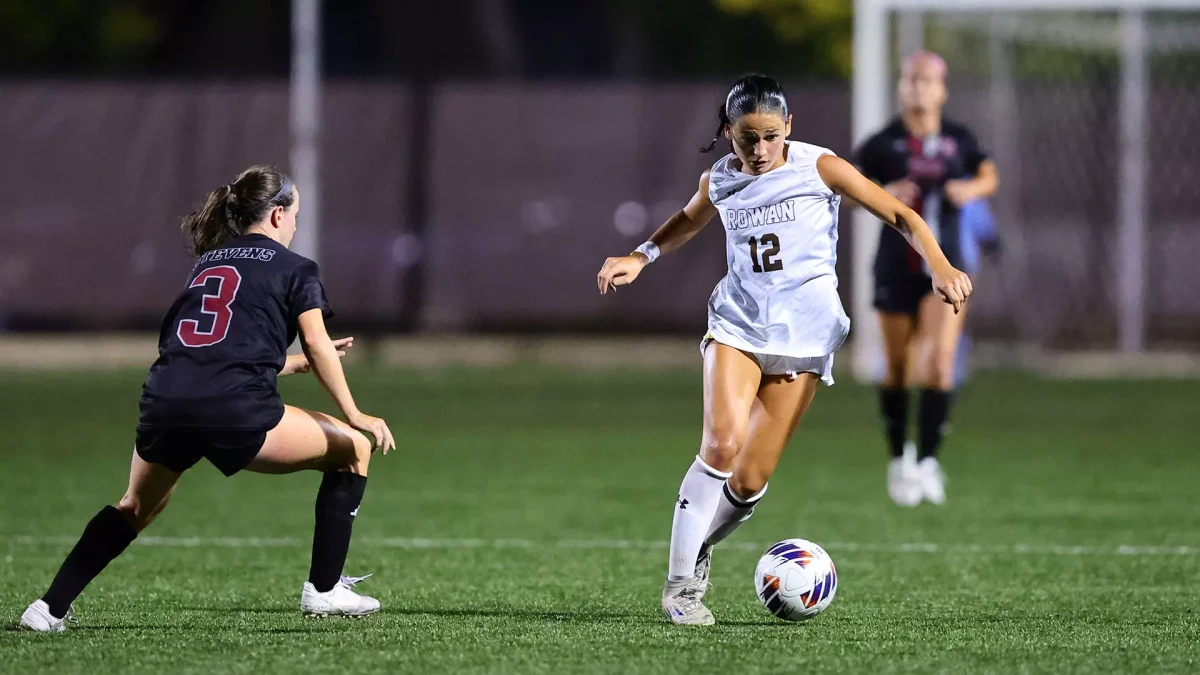 Lianna SanFelice weaves up the field. The junior scored her second goal of the season against Montclair State on her second free kick. - Photo via Rowan Athletics