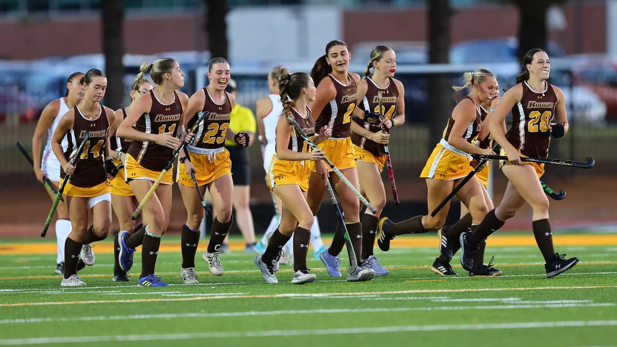 Rowan field hockey heads out to the field. The team put forth a dominant performance against William Paterson on Wednesday. - Photo via Rowan Athletics