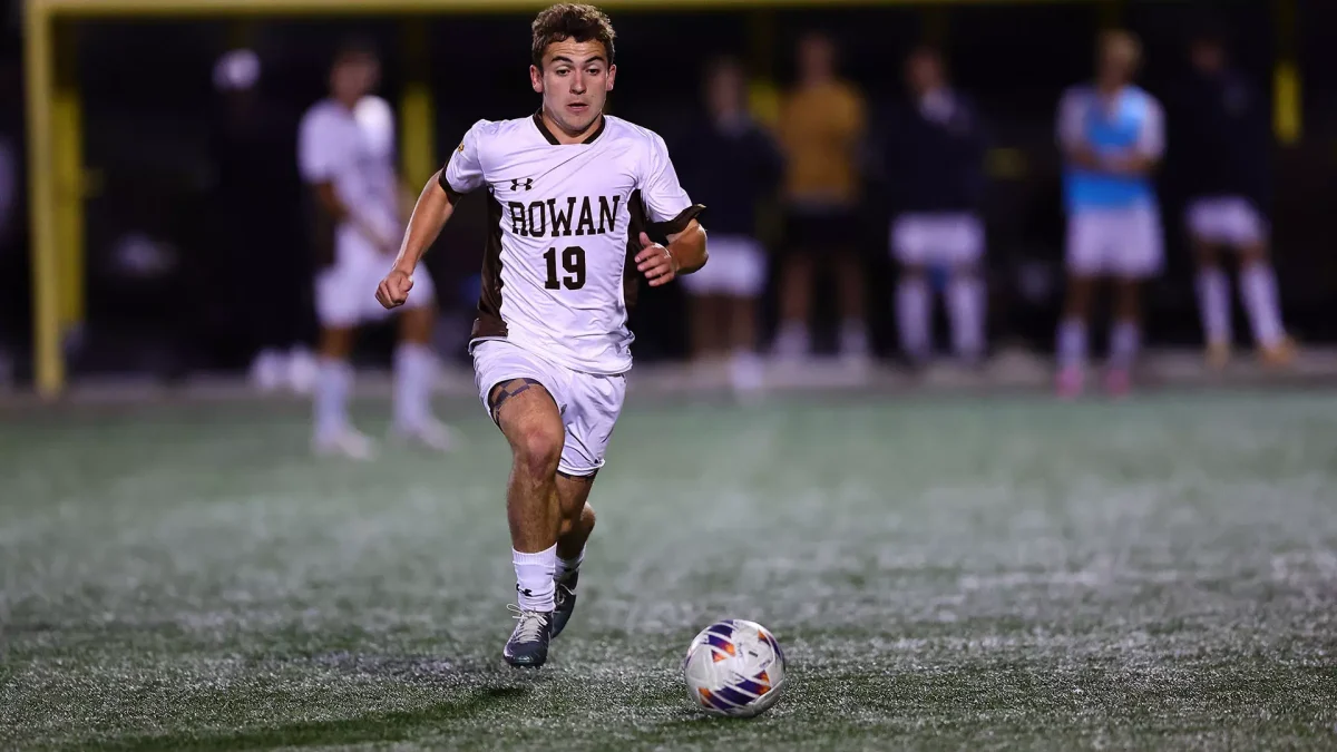 Johnny Troiano hustles up the field. The junior scored his team-leading 12th goal of the season against Montclair State. - Photo via Rowan Athletics