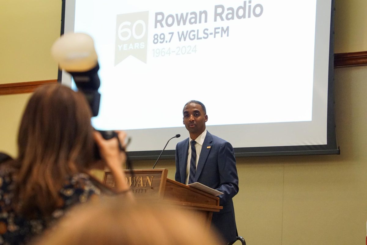 Derek Jones, Rowan Radio's station manager, introduces the night's program and panelists in the Chamberlain Student Center, Glassboro, NJ. Friday, Sept. 27, 2024. - Photography Editor / Gavin Schweiger