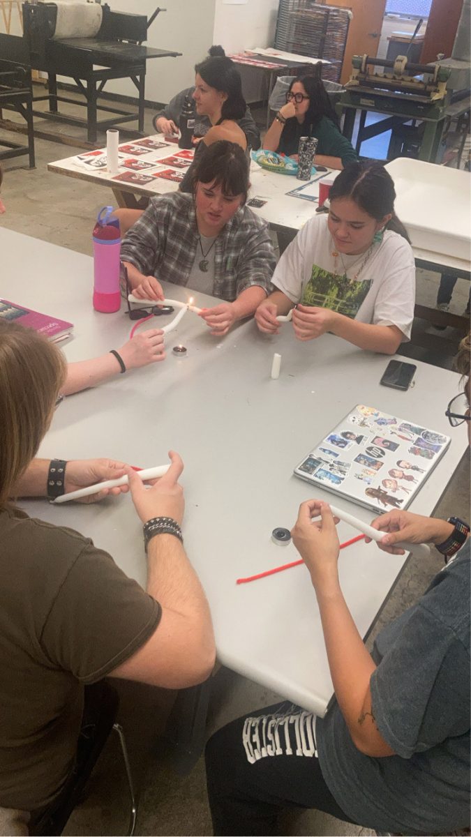 Students making Halloween themed candles at the Women and Westby event. - Staff Writer / Dakim Marcel Randolph