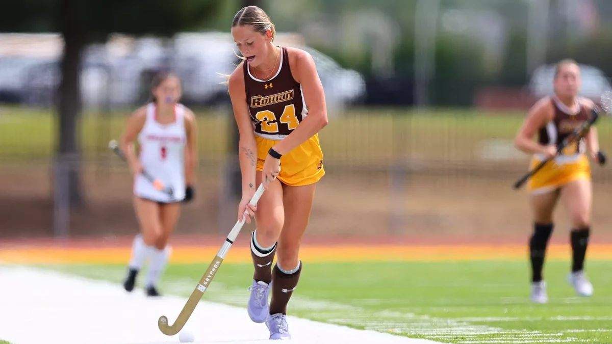 Jenna Gray brings the ball up. Gray tallied two goals in the win over Stockton. - Photo via Rowan Athletics