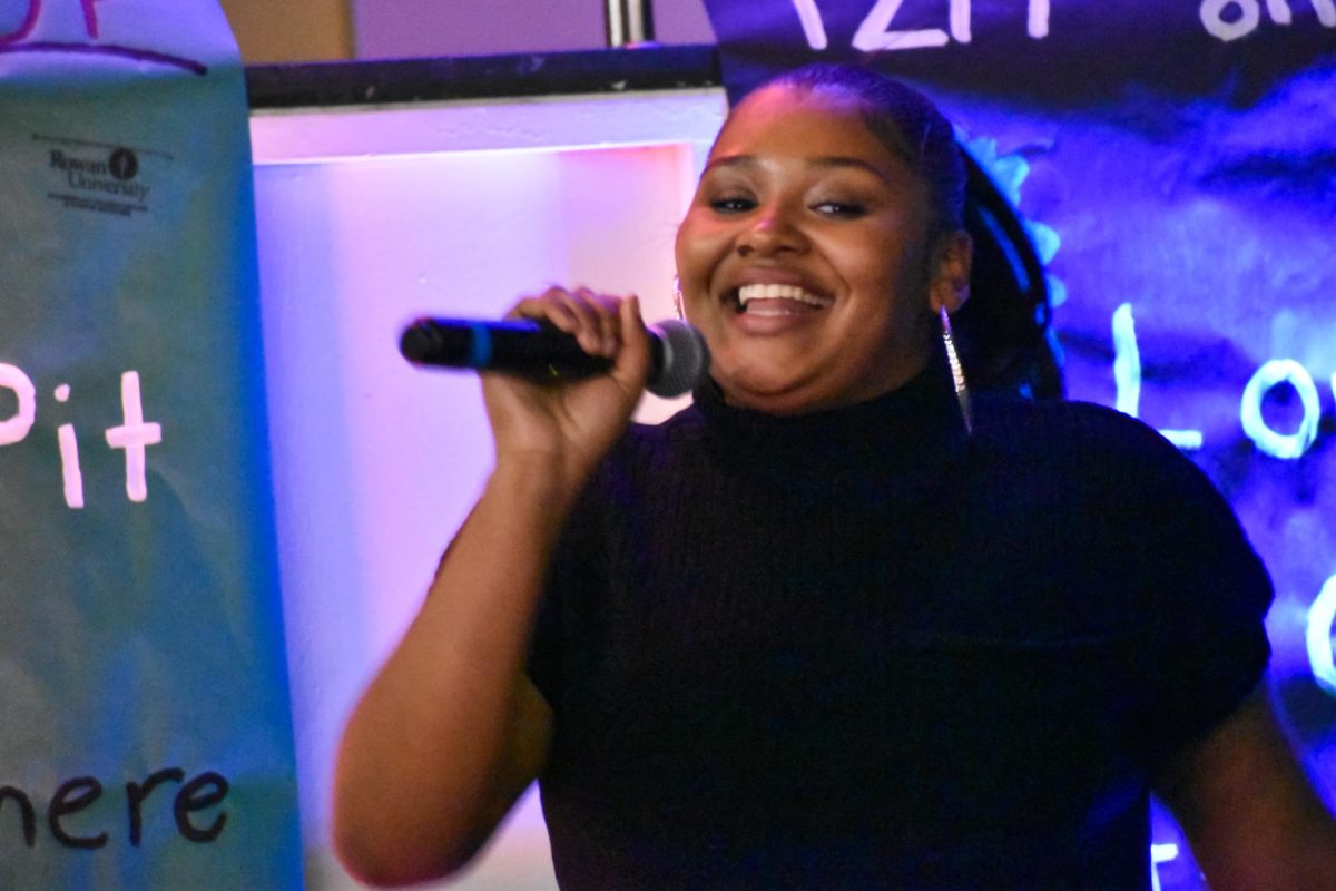 A student sings "My Boo" by Alicia Keys and Usher at the Rowan Jazz and Spoken Word Night at the Chamberlain Student Center. Glassboro, NJ. Friday, November 9, 2024. - Staff Photographer / Owen Miller