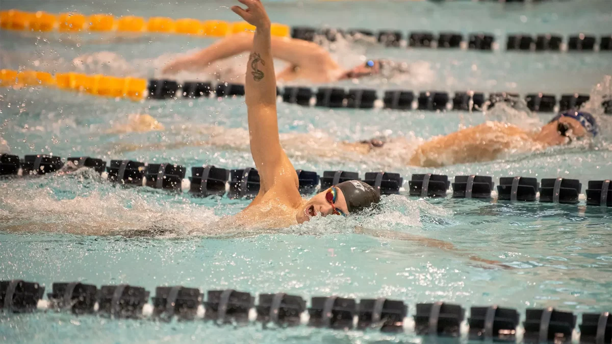 Tobias Cahnbley competes in a race. Cahnbley won the 200 free and 200 back in the win over Montclair State. - Photo via Rowan Athletics