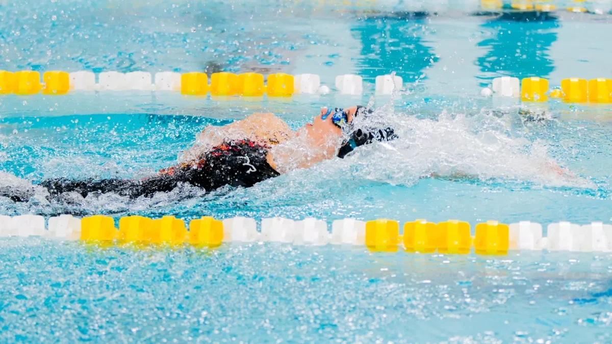 Ella Pennington competes in the backstroke. The junior has been named NJAC Swimmer of the Week two times in a row to start the season. - Photo via Rowan Athletics