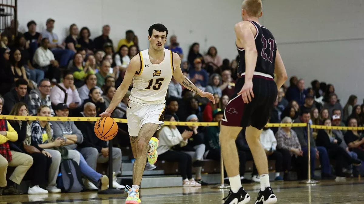 Danny Fleming drives up the floor. The senior scored 15 points against Eastern. - Photo via Rowan Athletics