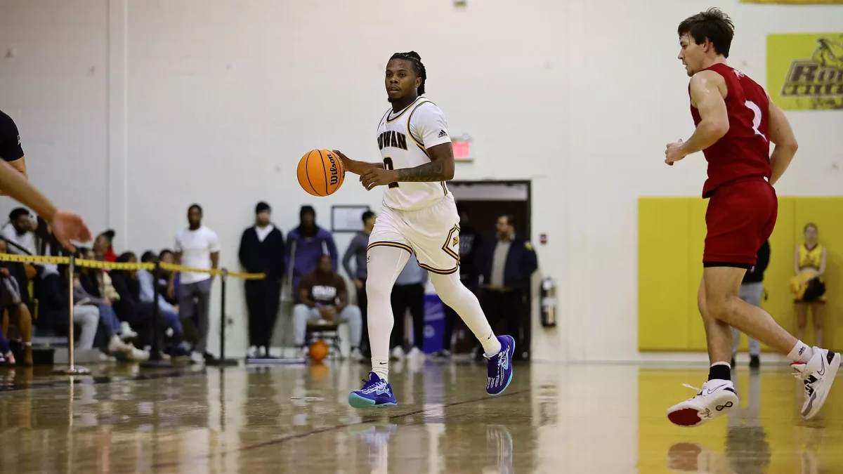 Taz Cantey dribbles up the court. Cantey poured in 21 points in the win. - Photo via Rowan Athletics