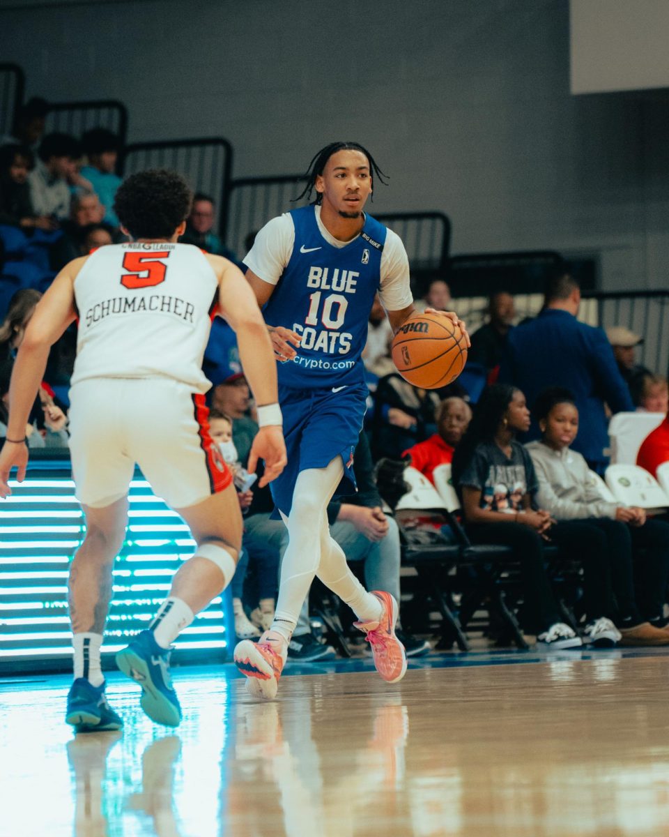 Judah Mintz brings the ball up the court. Mintz recorded 25 points in the loss. - Photo via Shamar Swann