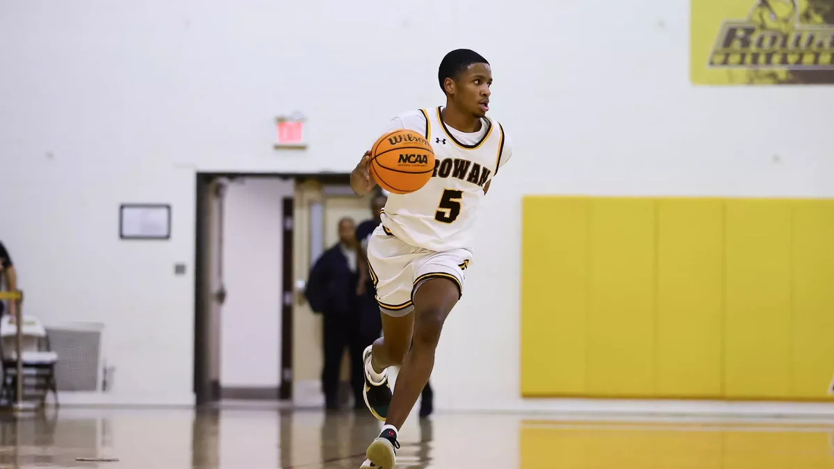 Brycen Williams runs up the floor. The junior scored a team-high 17 points against NJCU. - Photo via Rowan Athletics