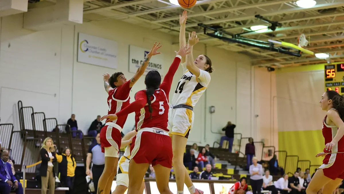 Haley Selmer puts a shot up. Selmer recorded 16 points in the losing effort. - Photo via Rowan Athletics