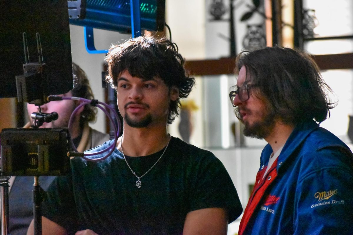 Director Brandon Martin (left), and director of photography Riley Granata (right) review a take for Cinema Workshop's short film "Act Natural" at the Chamberlain Student Center. Glassboro, NJ. Saturday, Feb. 8, 2025. -Staff Photographer /  Owen Miller