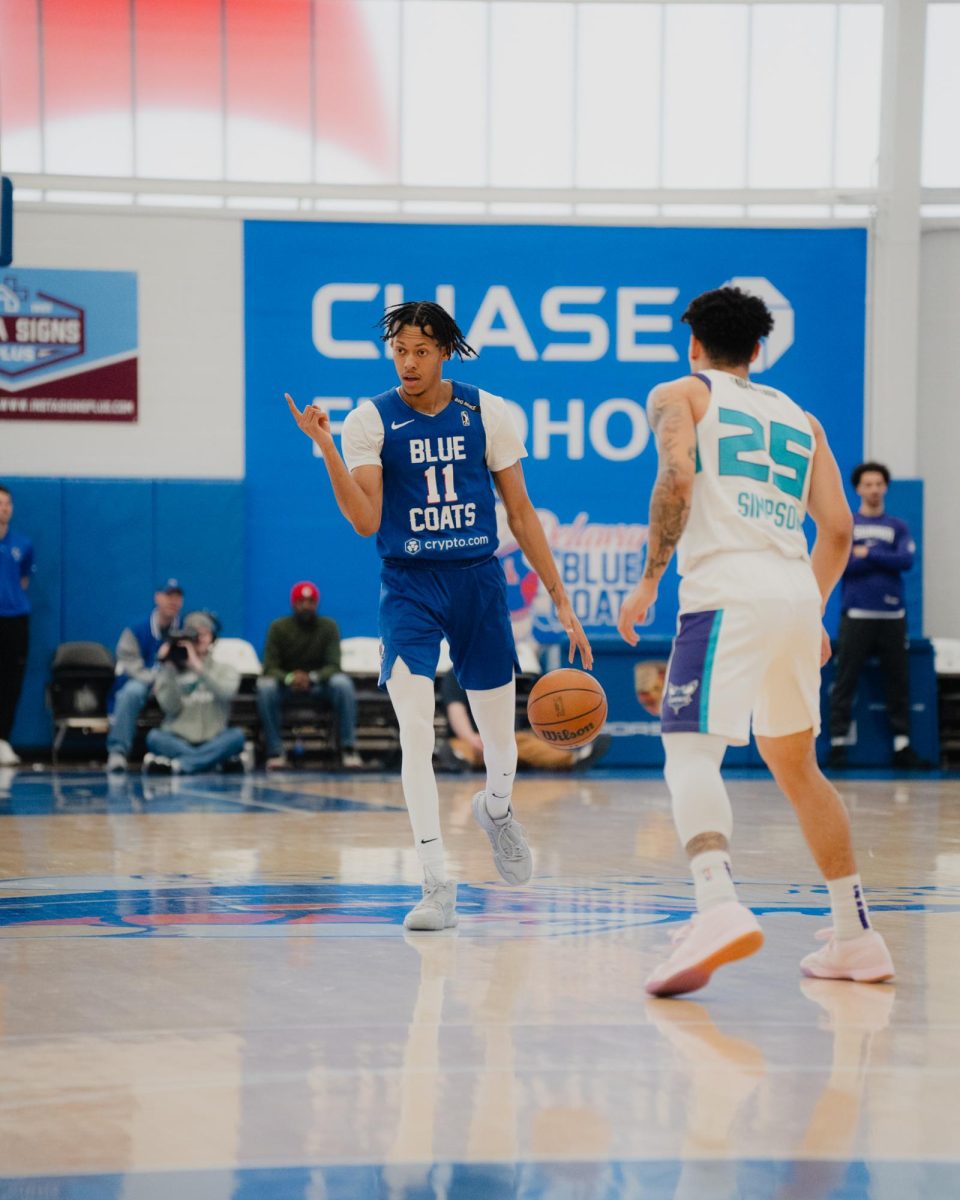 Jeff Dowtin Jr. brings the ball up the court. Dowtin struggled in the loss against the Magic. - Photo via Shamar Swann