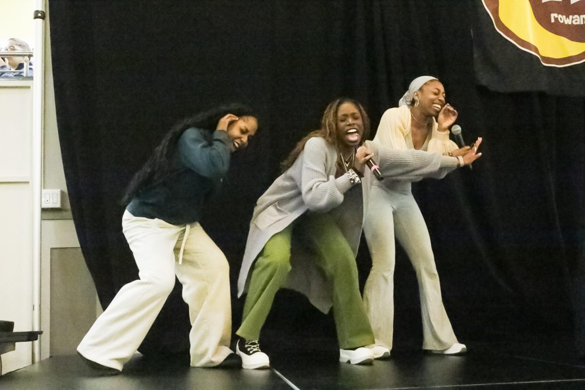 Avari Oliver, Mikayla Griffin, and Sage Tawfree perform karaoke at RAH and BSU’s Black Hair Don’t Care event at Rowan university. Glassboro, NJ. Thursday, Feb. 13, 2025. - Contributor / Aliyah El-Muhammad