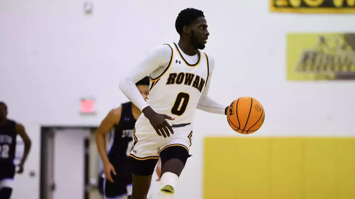 Khalif Meares brings the ball up the court. Meares recorded 24 points in the win. - Photo via Rowan Athletics