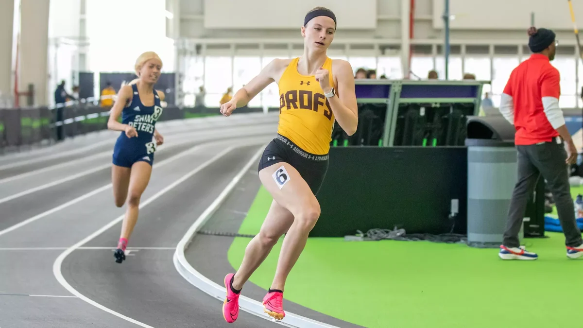 Molly Lodge sprints towards the finish line. Lodge was a member of the 4x400 team that recorded a season-best time at the METS Championships. - Photo via Rowan Athletics