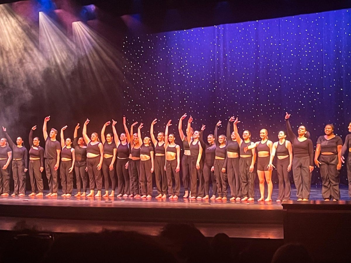 Dance Extensions group on stage in Pfleeger Concert Hall. - Staff Writer / Lily Miller 