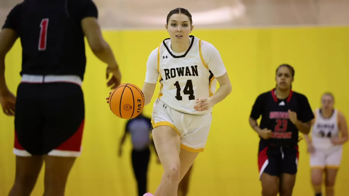 Haley Selmer brings the ball up the court. Selmer finished with 10 points and five rebounds. - Photo via Rowan Athletics