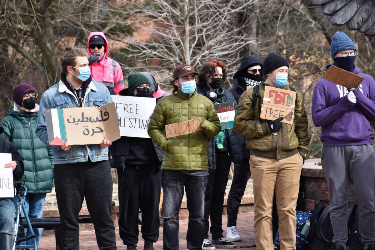 Students hold signs protesting SJP's discontinuation in front of the owl statue on campus, Glassboro, NJ. Tuesday, February 18, 2025. - Staff Photographer / Owen Miller