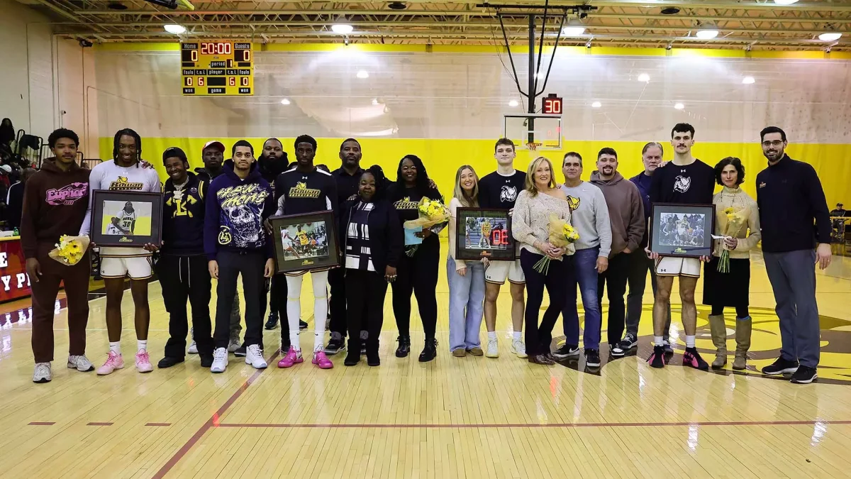 Rowan men's basketball celebrates Senior Day with their families. - Photo via Rowan Athletics