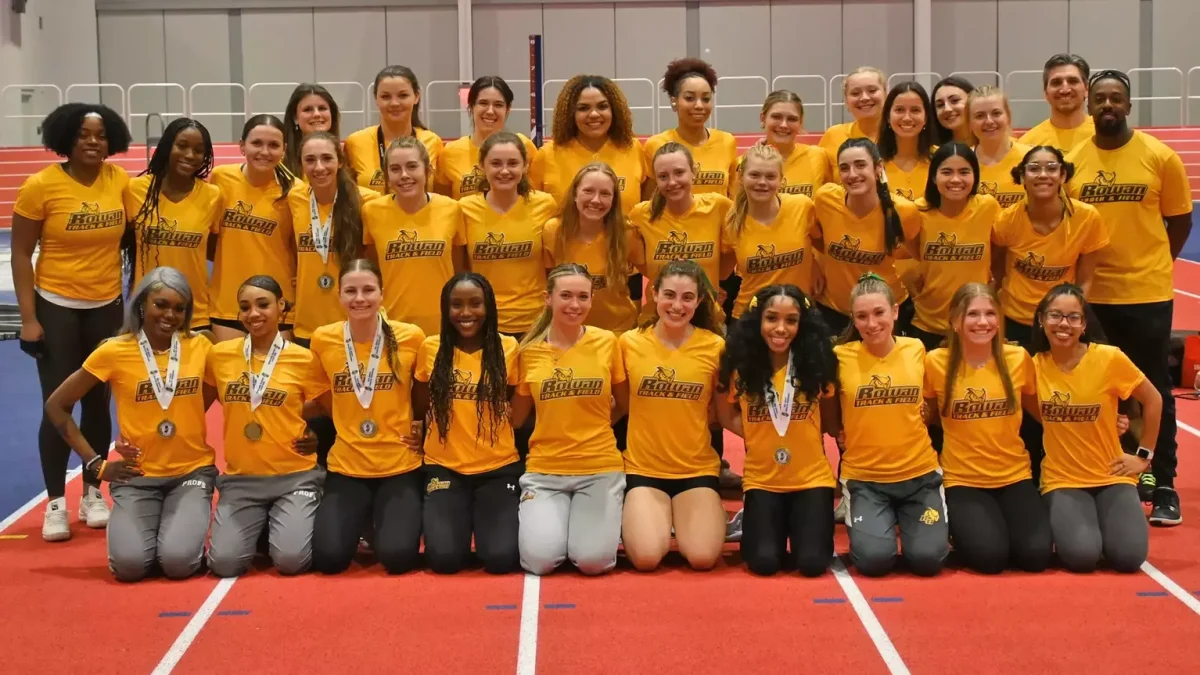 Rowan women's indoor track and field celebrates their second-place finish at the NJAC Championships. - Photo via Rowan Athletics.