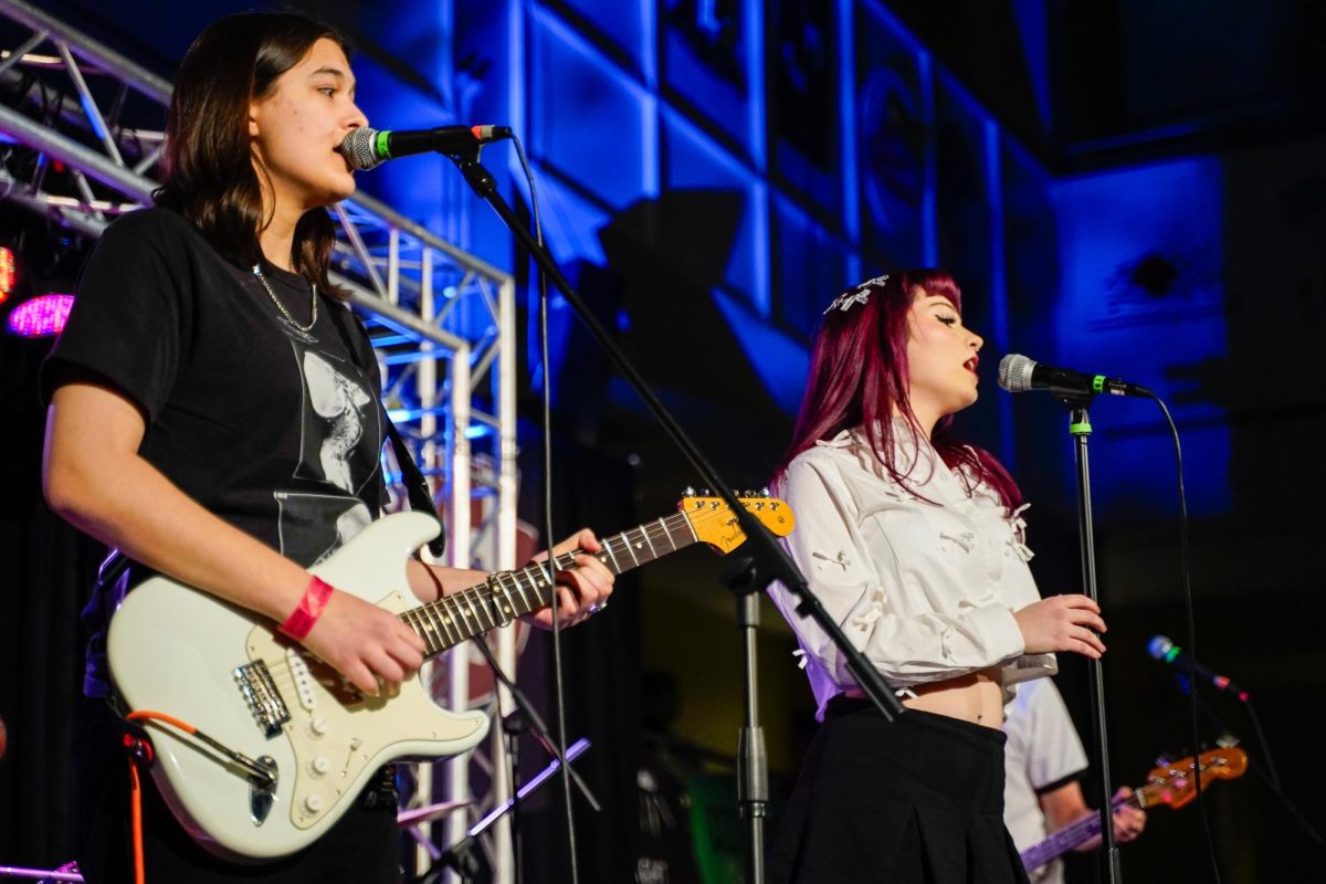 LVNA members Liz Rohr, left, and Madeline Reddy, right, sing at RAH and SUP's Battle of the Bands. Glassboro, NJ. Saturday, March 1, 2025. - Photography Editor / Gavin Schweiger