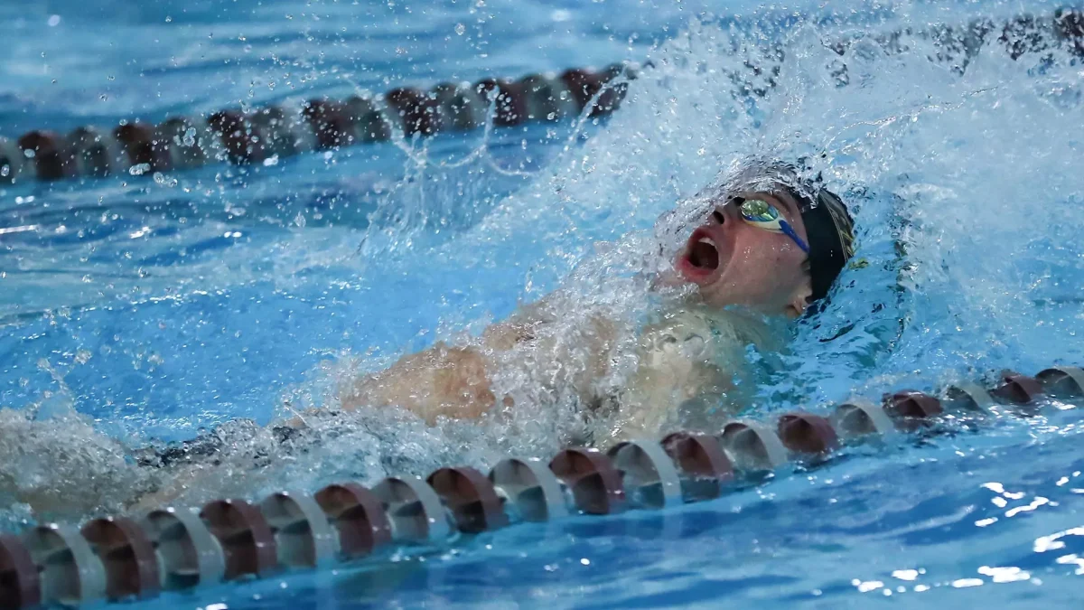 Jack Watson competes in the backstroke. Watson is preparing for his final meet at Rowan. - Photo via Rowan Athletics