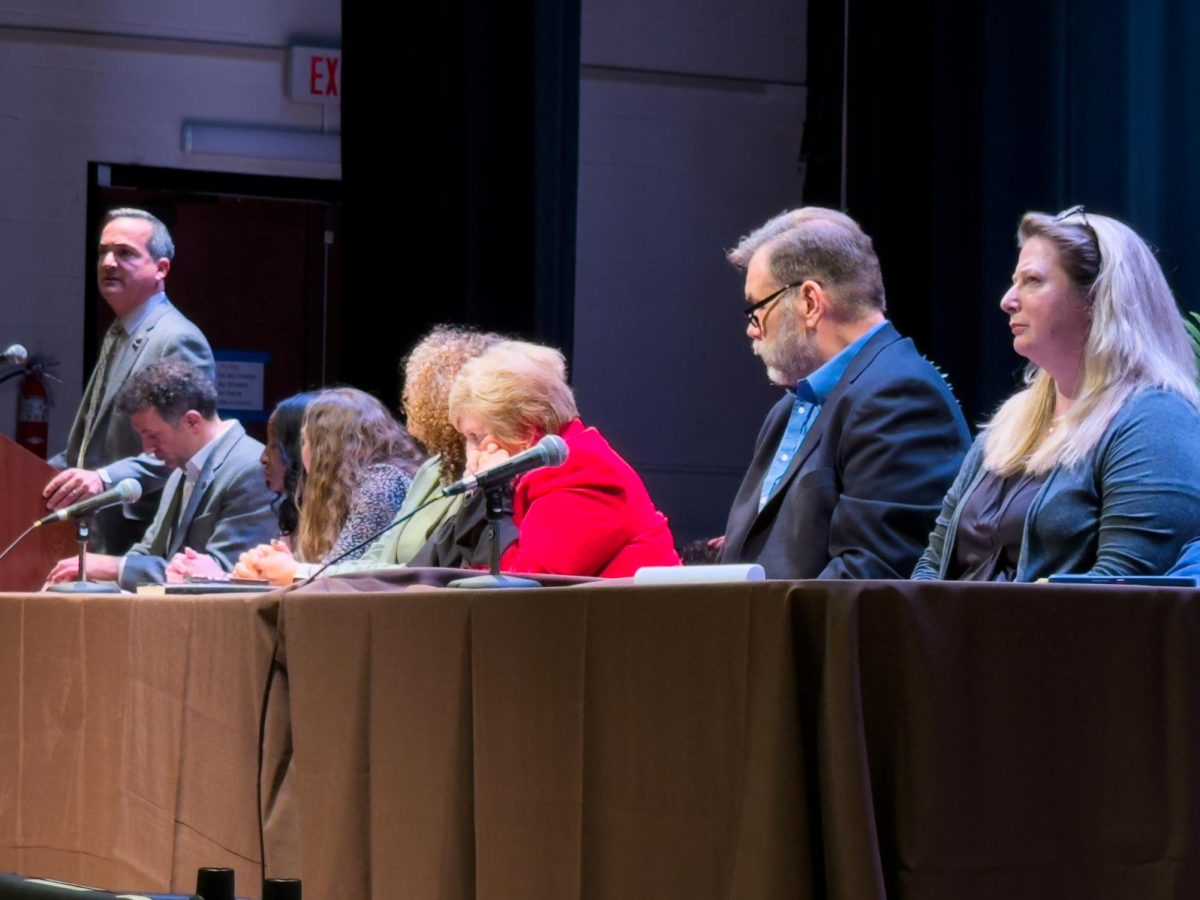 From left, Administrators Dr. Anthony Lowman, Gokhan Alkanat, Dr. Kha’ Sadler, Melissa Wheatcroft, Dominique Pierson, Terri Drye, Dr. Kevin Koett, and Rory McElwee, sit on a panel addressing recent DEI policy shifts, along with questions and concerns from members of the Rowan University’s community in Boyd Recital Hall. Glassboro, NJ. Friday, March 7, 2025. - Staff Writer / Essence Holman