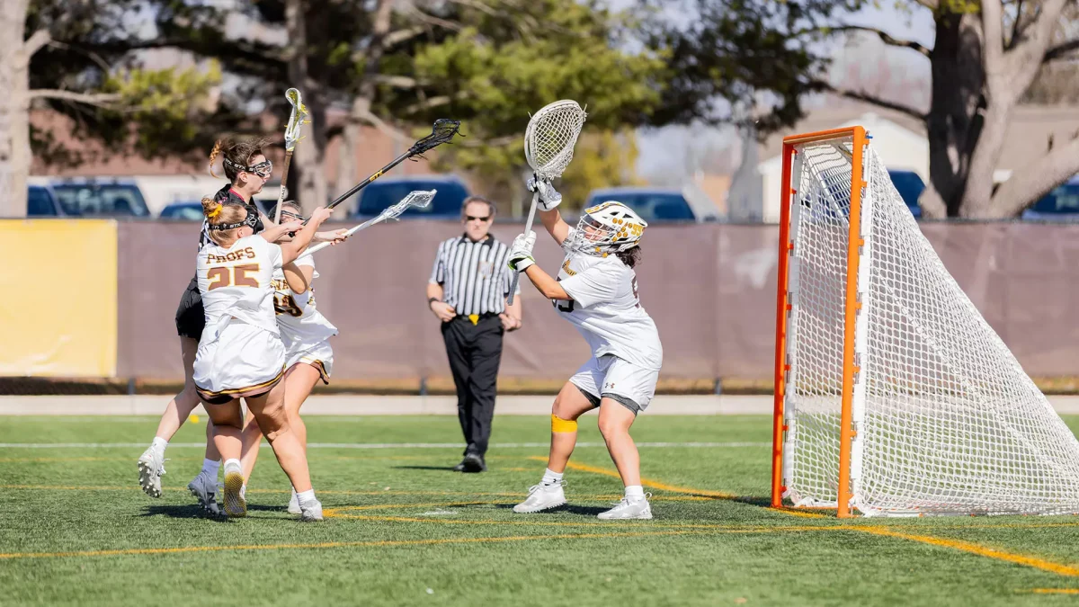 The Profs' defense swarms to prevent a shot attempt. - Photo via Rowan Athletics