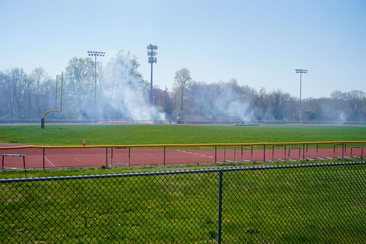 The fire burns near the football field at the Glassboro High School. Glassboro, NJ. Thursday, April 17, 2025.- Photography Editor / Gavin Schweiger