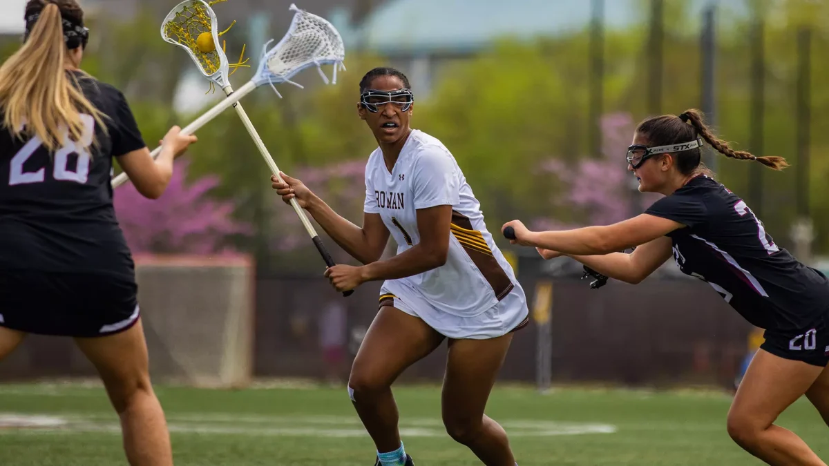 Yasmin Harris dodges a defender. Harris scored a hat trick versus Montclair State. - Photo via Rowan Athletics