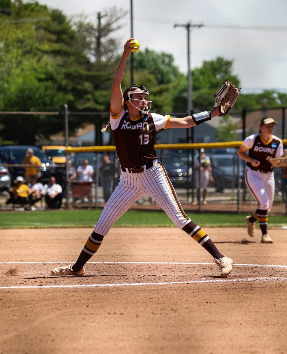 Rylee Lutz unloads a pitch. Lutz achieved her third-straight season with 20 more wins and 100+ strikeouts with her Saturday performance. Glassboro, NJ. Saturday, May 17, 2025. - Photo via @rowansoftball on Instagram