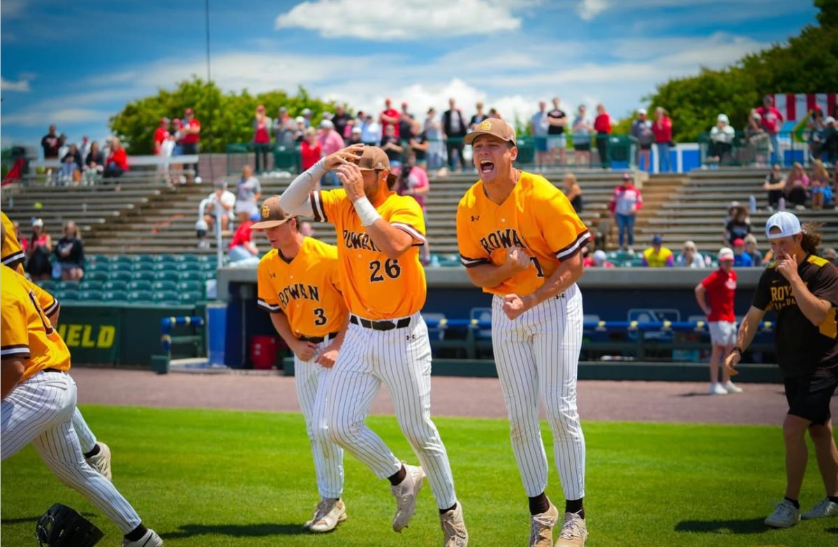 Coluccio (right) runs out of the dugout to celebrate with his teammates on the mound after their win. Coluccio pitched five shut out innings to send his team to the College World Series. Lynchburg, Va. Saturday, May 24, 2025. - Photo via Kaeden Murphy