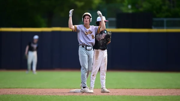 Jason Morgan celebrates his two-RBI double in the top of the seventh inning. Morgan went 3-for-5 with five RBIs in the Profs victory over Trinity. Eastlake, Ohio. Sunday, June 1, 2025. - Photo via Rowan Athletics
