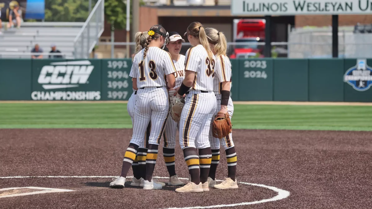 Rowan softball's infield meets with Rylee Lutz on the mound. Bloomington, Ill. Saturday, May 31, 2025. - Photo via Rowan Athletics