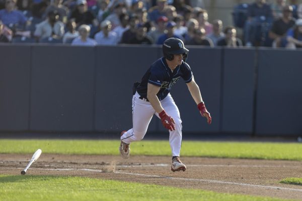 Sam Petersen hustles out of the batter's box. - Photo via Ryan Griffith