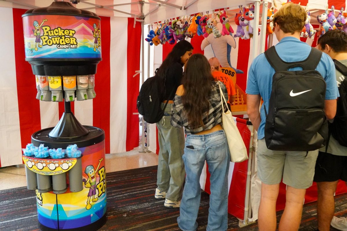 Students retreat from the rain outside to play a few rounds of ring toss. Wednesday, Sept. 17, 2025. Glassboro, NJ. (Staff Writer / Michael Bautista)