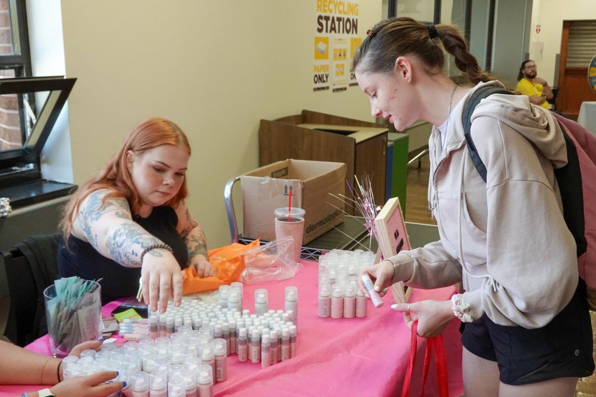 Emily Jackson, experience manager at Ulta Beauty, hands out free samples of Drybar, Peach & Lily, and Buxom to students. Fri. Sept. 26, 2025. Glassboro, NJ. (Staff Writer / Michael Bautista) 